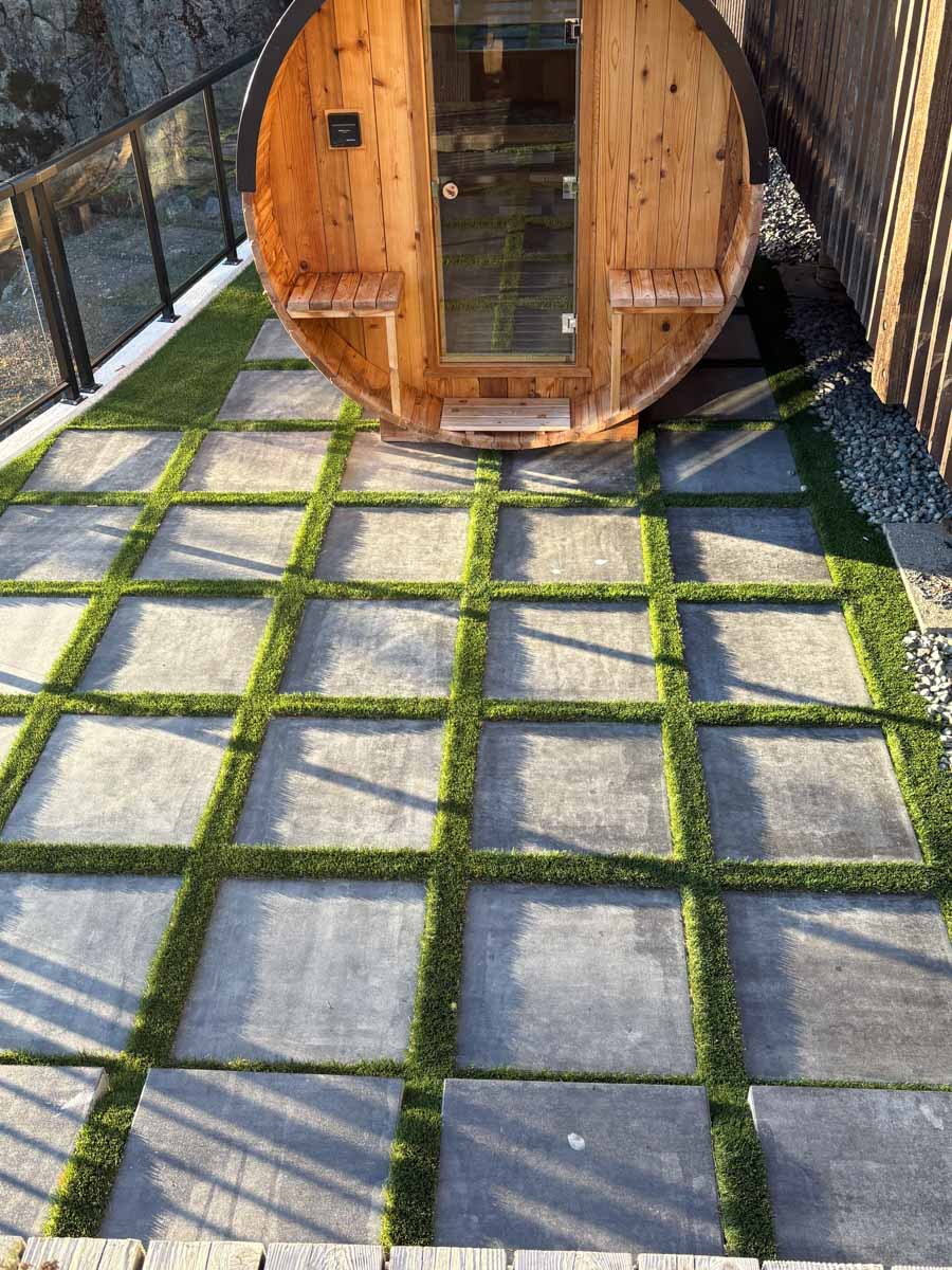 Artificial Turf Installation with sauna and stepping stones